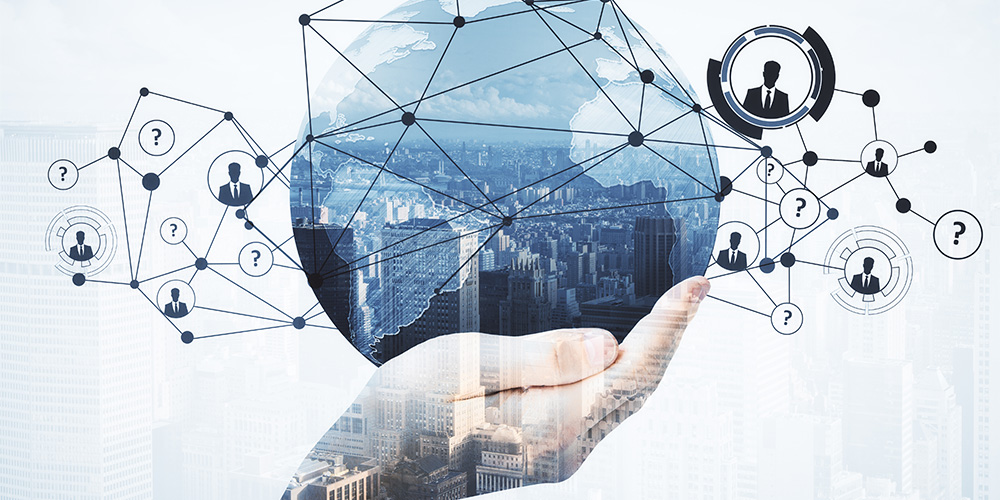 Hand holding a digital globe and connected network.